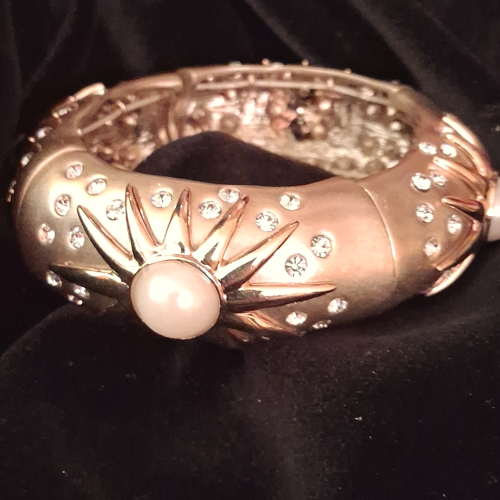 Goldtone metal bracelet with inset faux-pearls and rhinestines